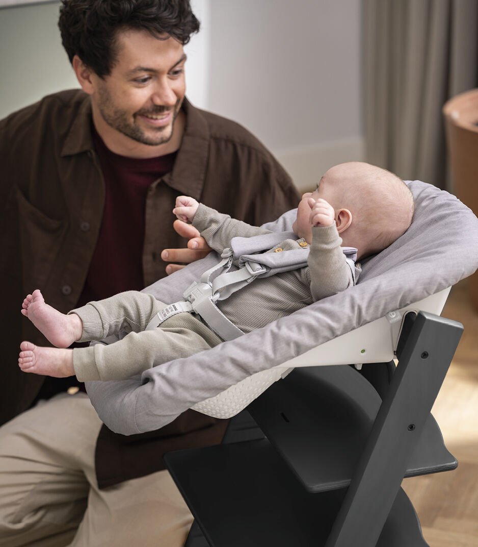 Tripp Trapp® Chair Black with Newborn Set, Grey. Close-up.